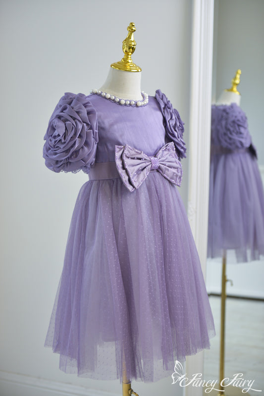 Side detail of sculpted floral sleeve and soft mesh skirt layers.