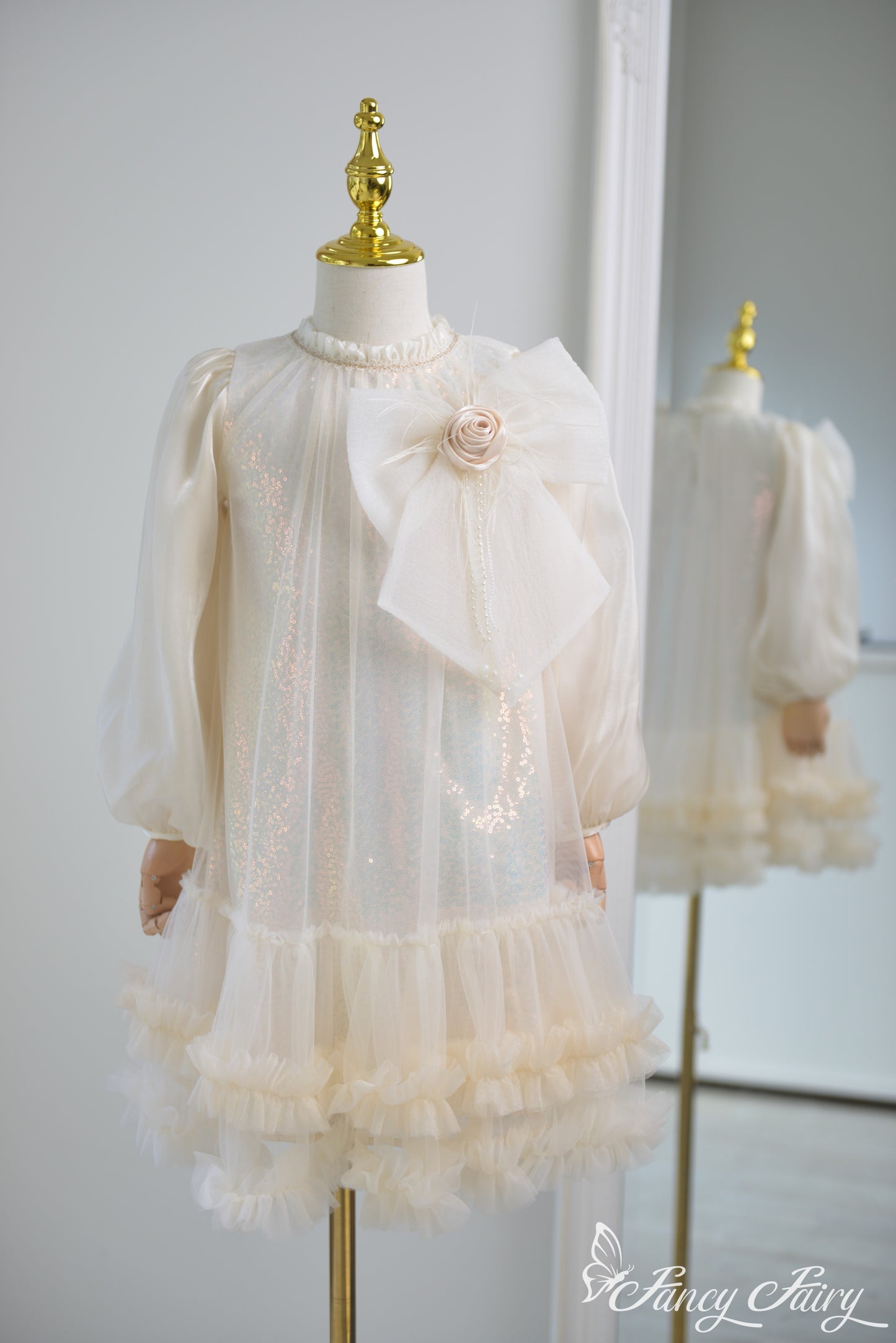 Front view of apricot girls' dress with large bow and ruffled hem – Fancy Fairy