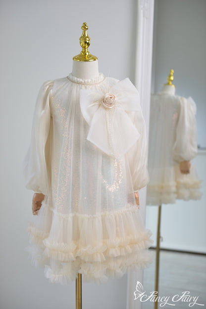Front view of apricot girls' dress with large bow and ruffled hem – Fancy Fairy