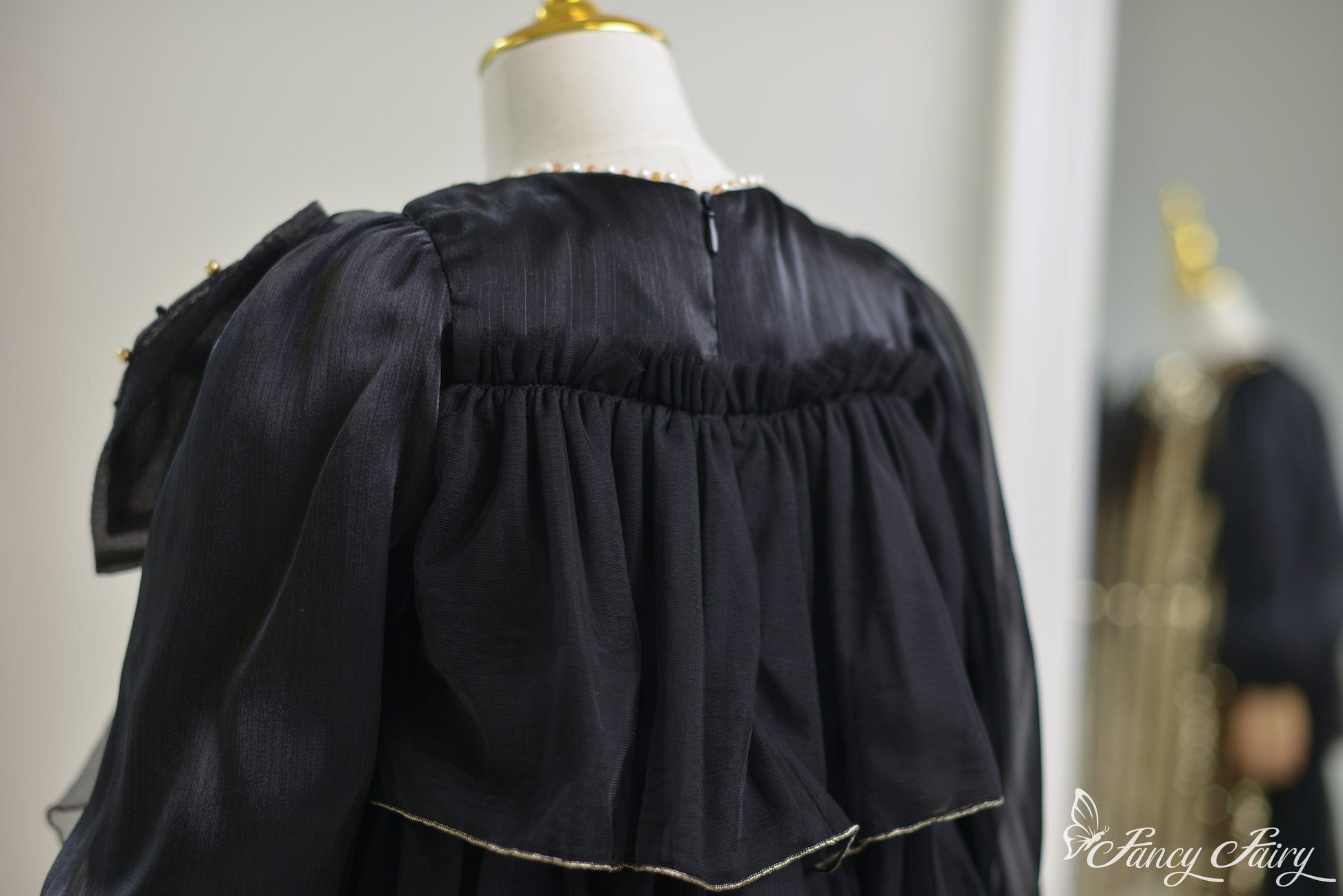 Back view of Black Gold Dress showing zipper closure.