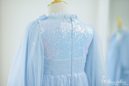 Back of dress with pleated waistband and glittery bodice.