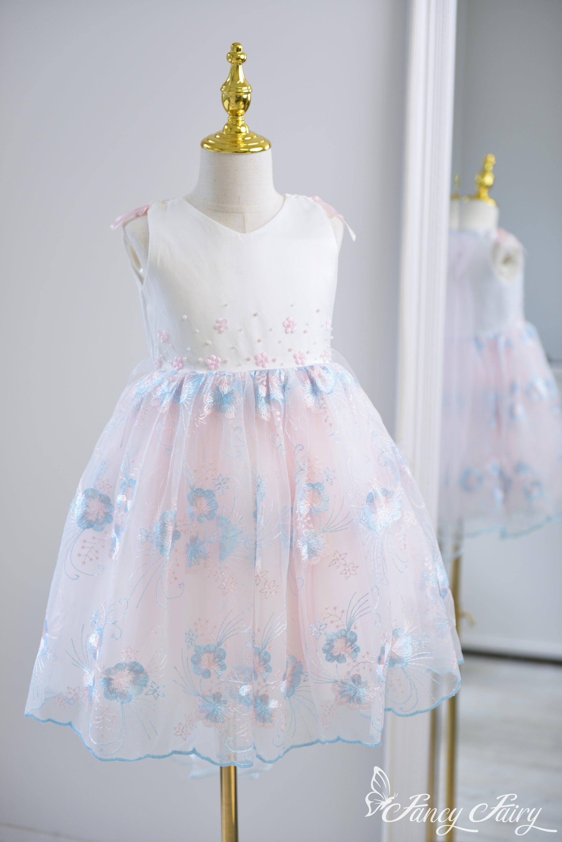 Full-length view of pink and blue floral dress.