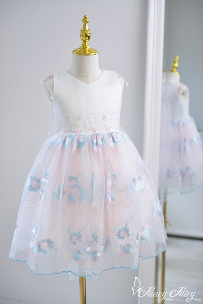 Full-length view of pink and blue floral dress.