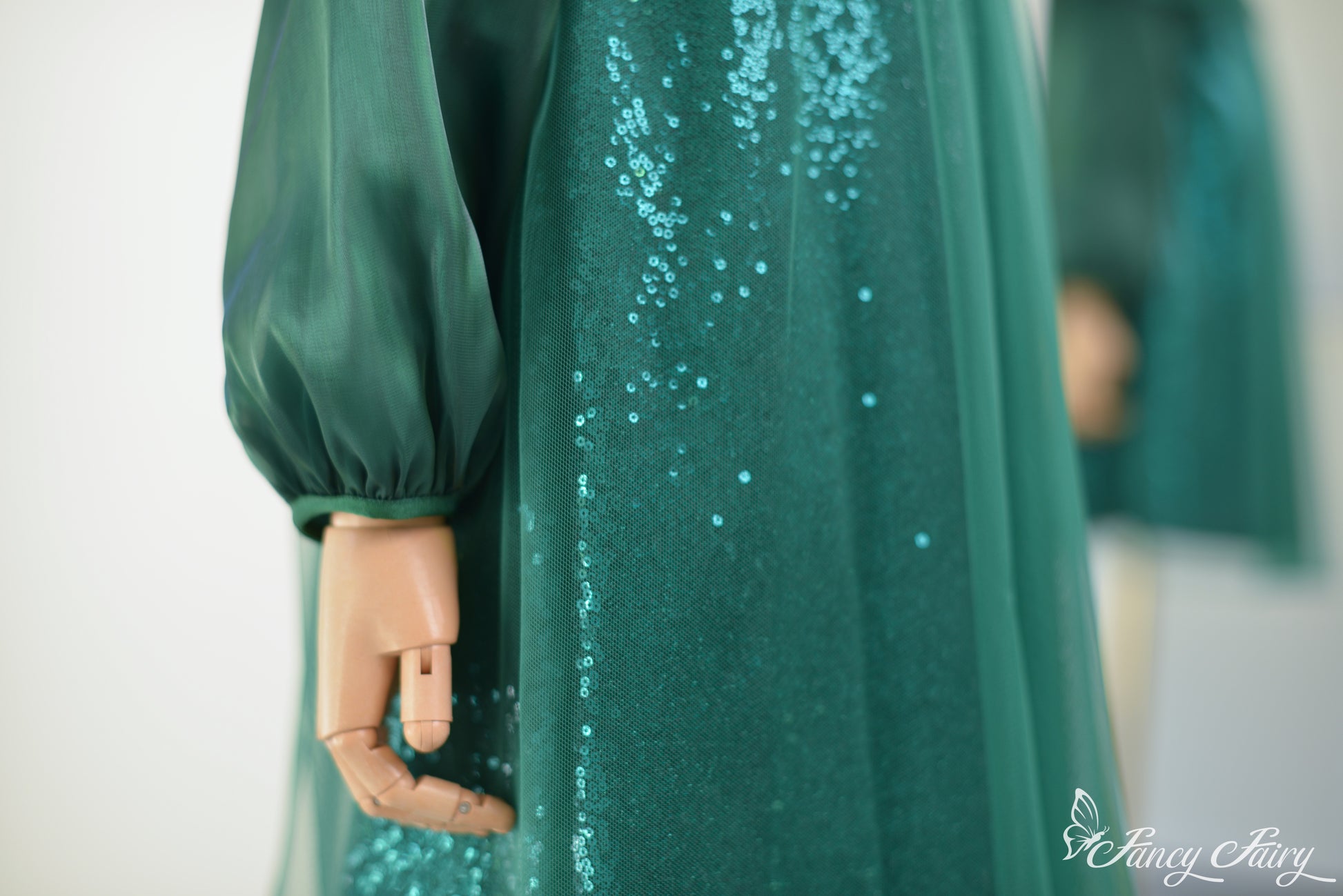 Detail shot of lower skirt showing shimmering sequin texture.