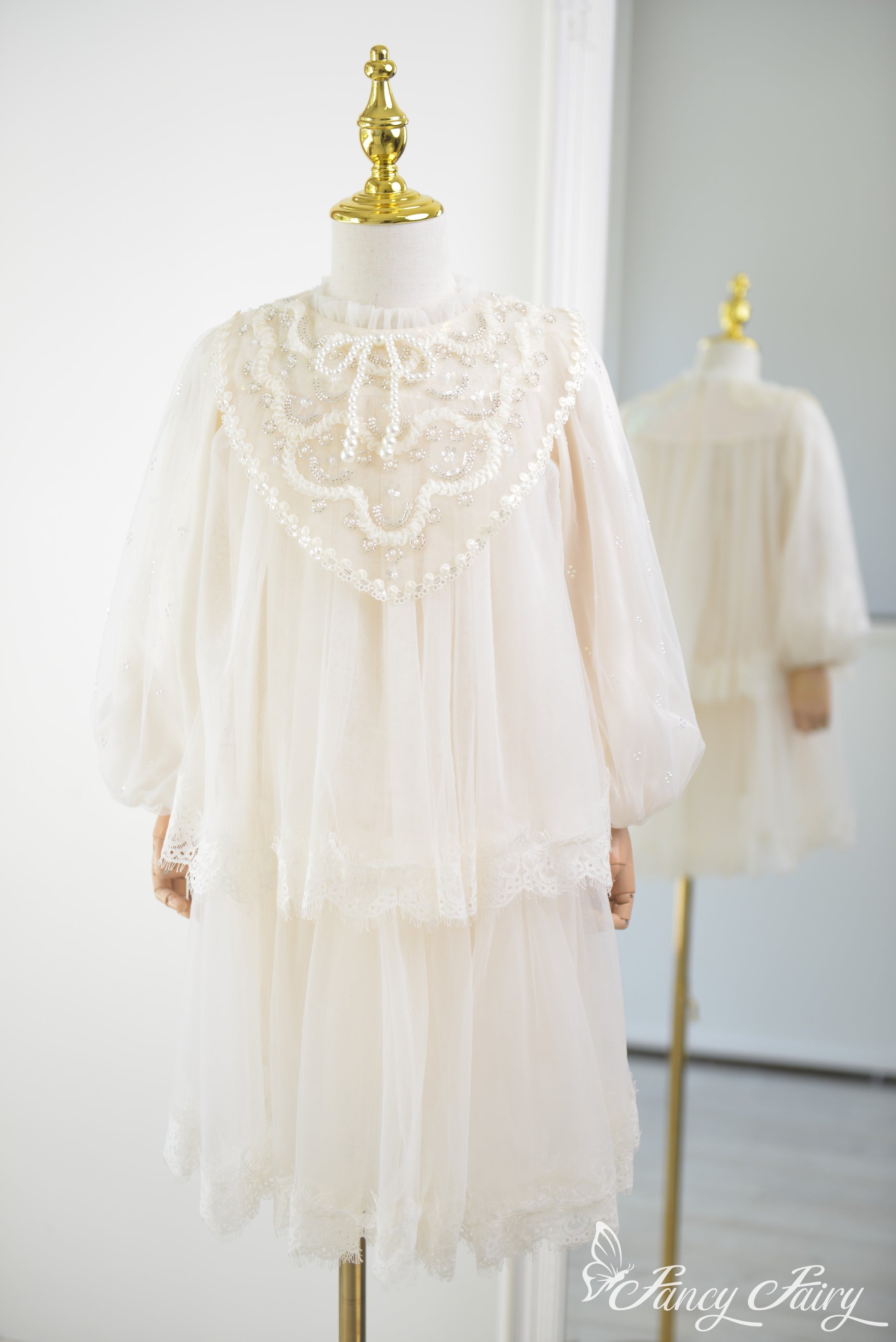 Front view of ivory girls' lace dress with puff sleeves and pearl embroidery – Fancy Fairy