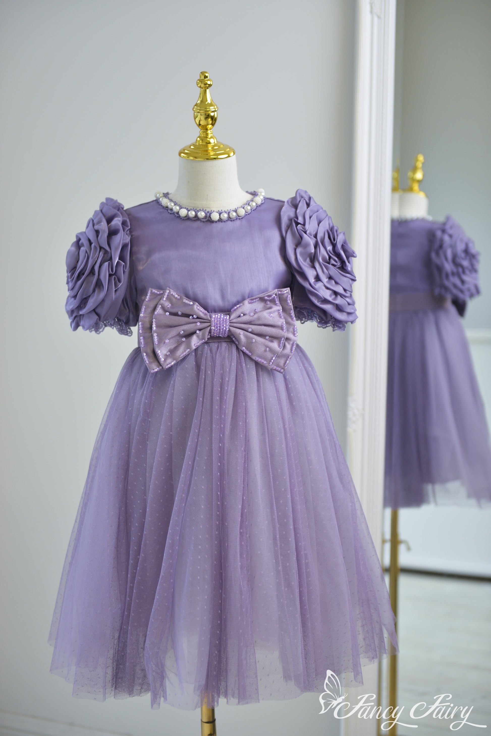 Front view of lavender girls' dress with rose puff sleeves, pearl neckline, and tulle skirt – Fancy Fairy
