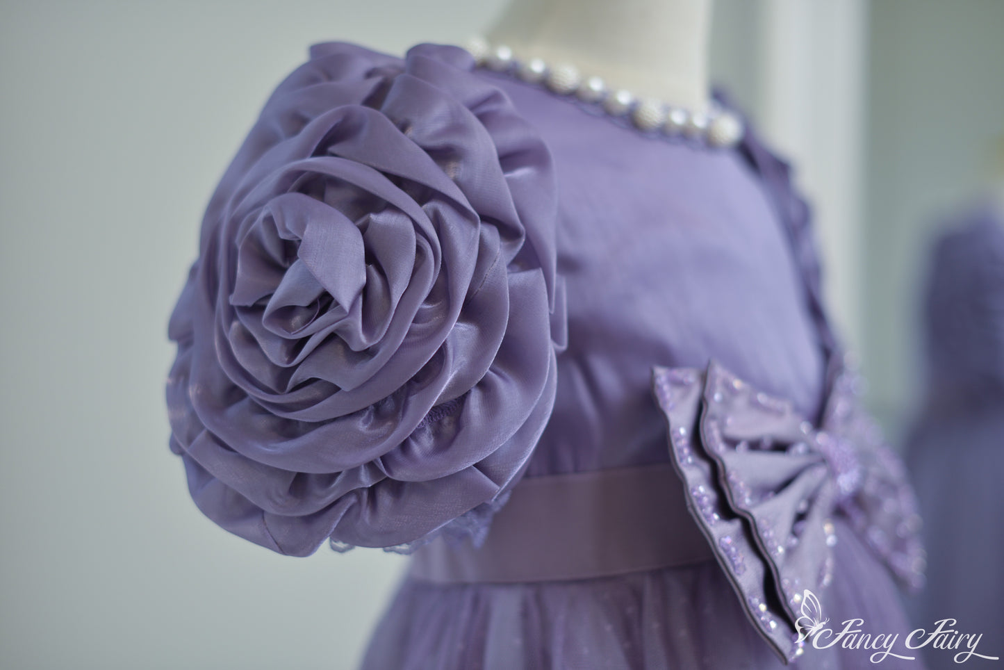 Detail of sculpted floral sleeve.