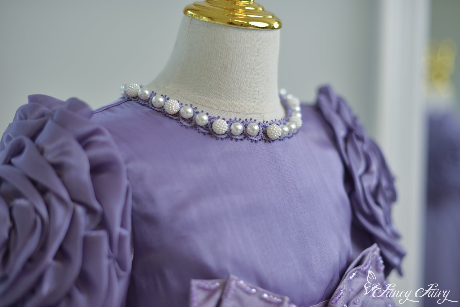 Detail of pearl beaded collar.