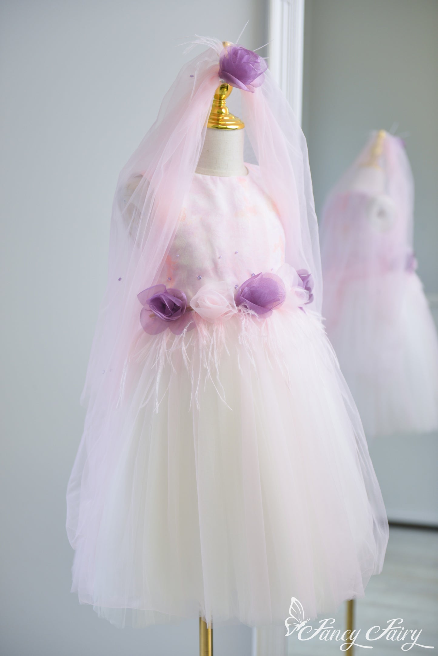 Full view of pink fairy dress with floral waist, and clip-on veil clipped in hair as an accessory – Fancy Fairy