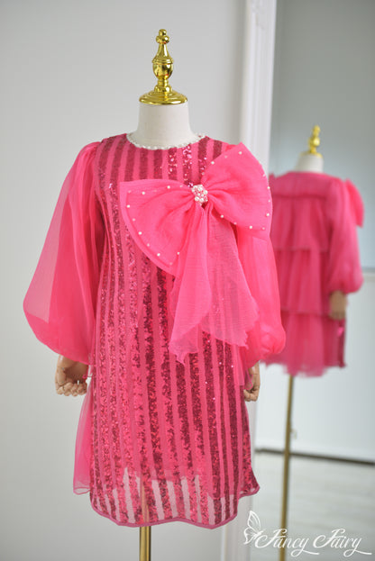 Front view of hot pink sequin dress with large pearl bow and sheer puff sleeves - Fancy Fairy