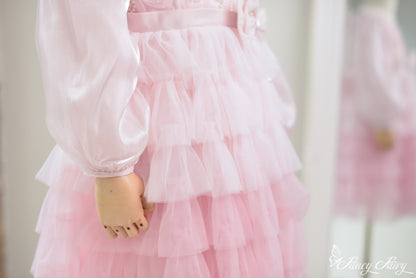 Zoom on layered ruffles with sheer fabric detail.