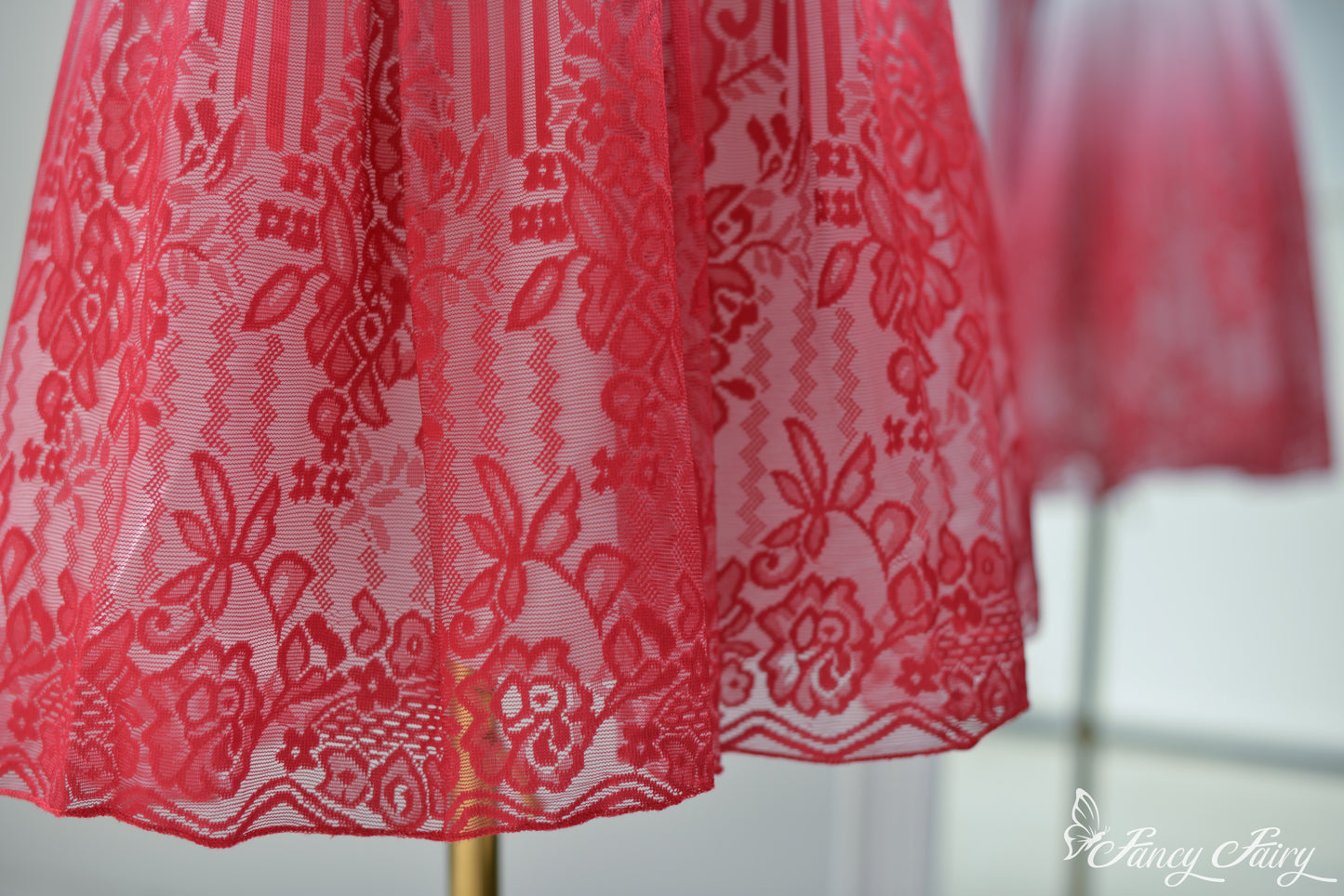 Hemline detail showcasing lace floral embroidery on the lower skirt.