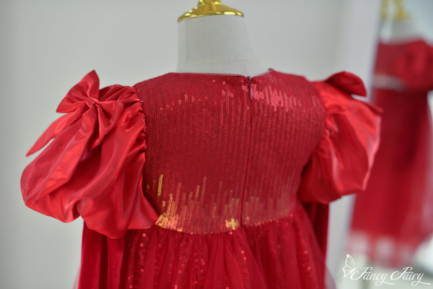 Back view zoom in of the dress showing sequin pattern on bodice.