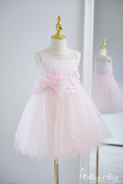 Angled view showing A-line shape and sparkly embroidered bodice.