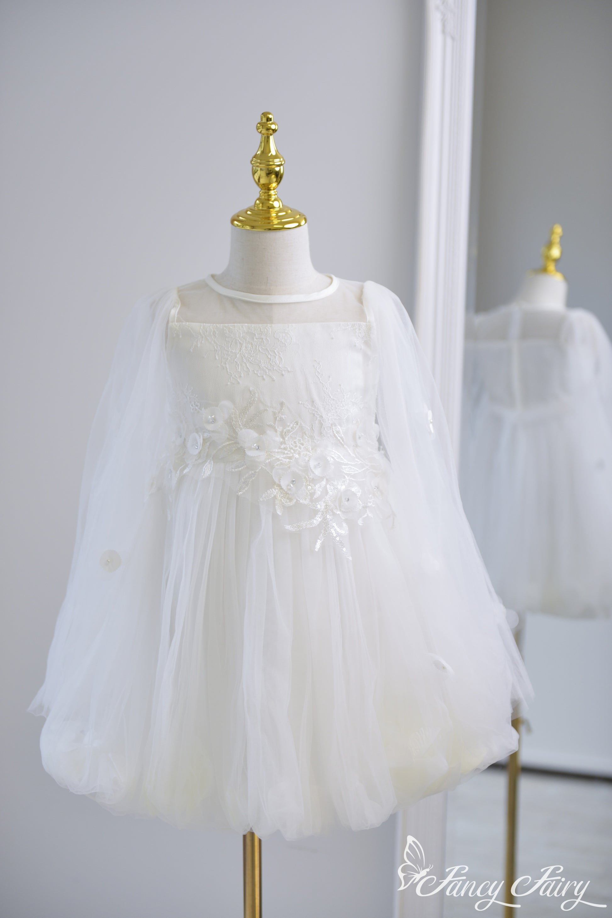 Front view of white girls' dress with floral embroidery, tulle sleeves, and petal-lined skirt – Fancy Fairy